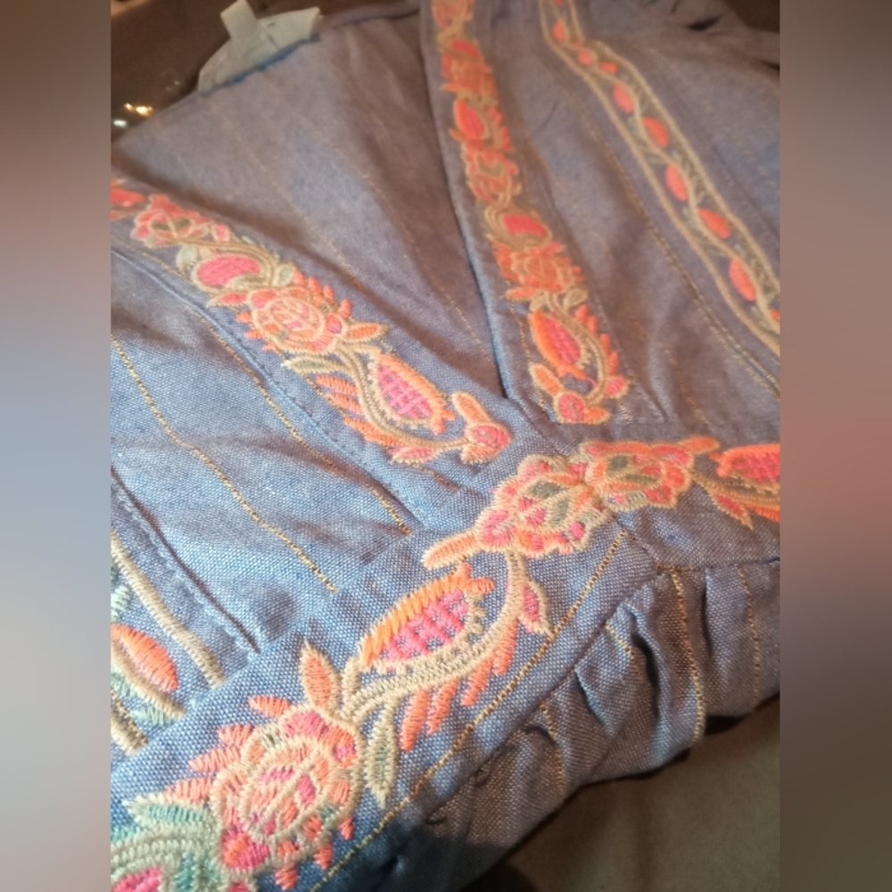 Brand new Entro blouse with ruffle sleeves. Size large. Blue with neon embroider